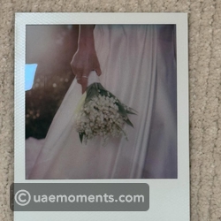 Look at her cute wedding bouquet!